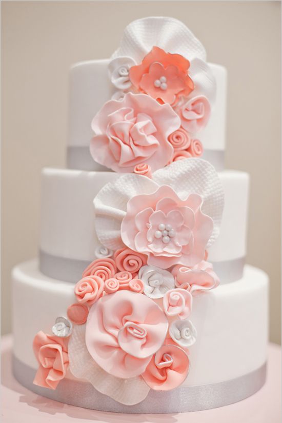 white wedding cake with sugar coral flowers