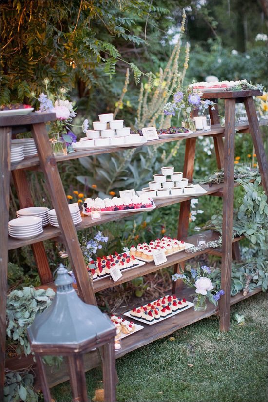 dessert display on wood ladders with plank shelves