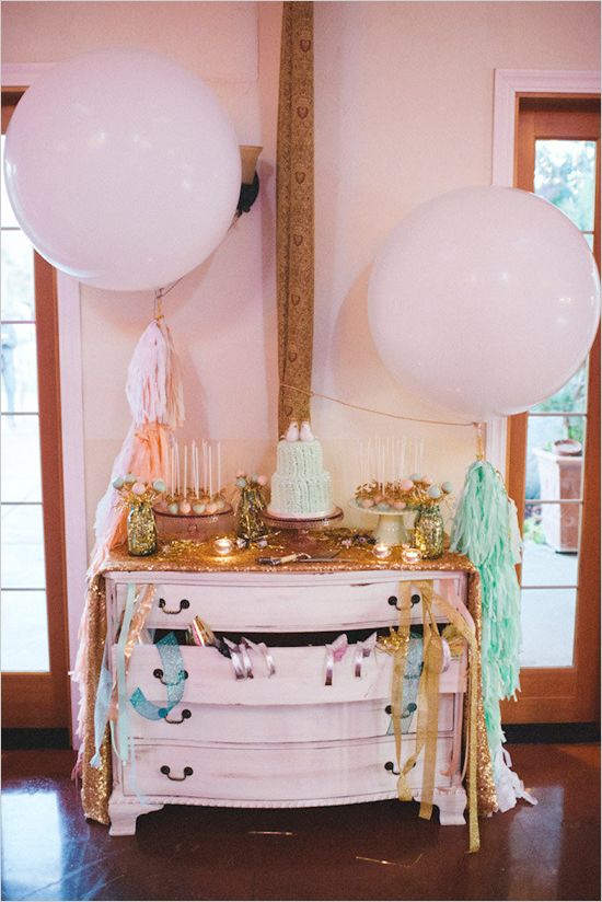 giant dessert table with balloons