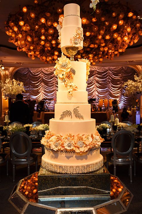 huge wedding cake with sugar coral flowers