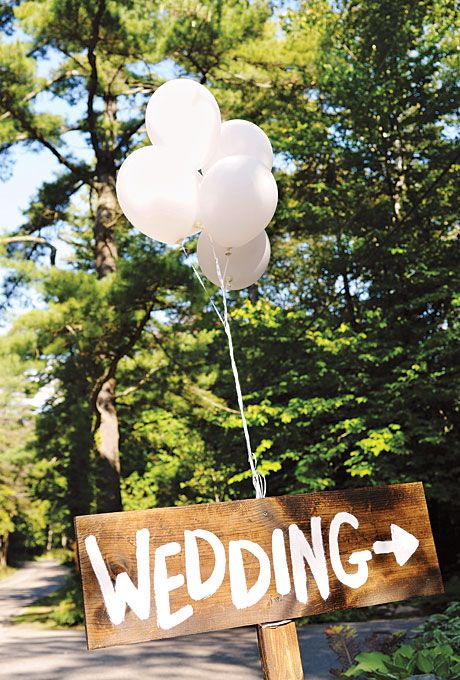 rustic wedding sign with white giant ballons