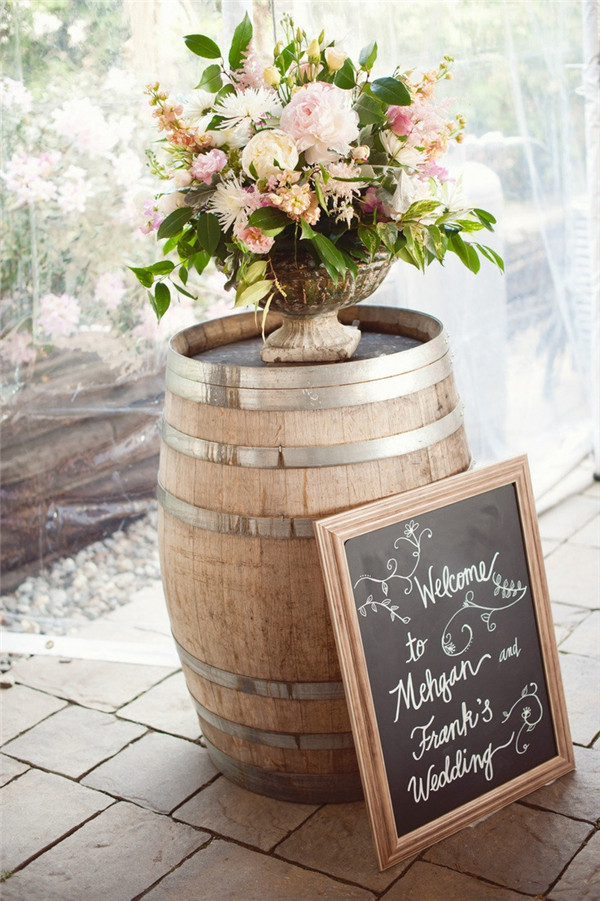 rustic wine barrel wedding decor with wedding sign