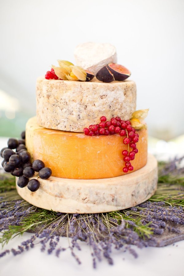 rustic yellow cheese wedding cake with fruits