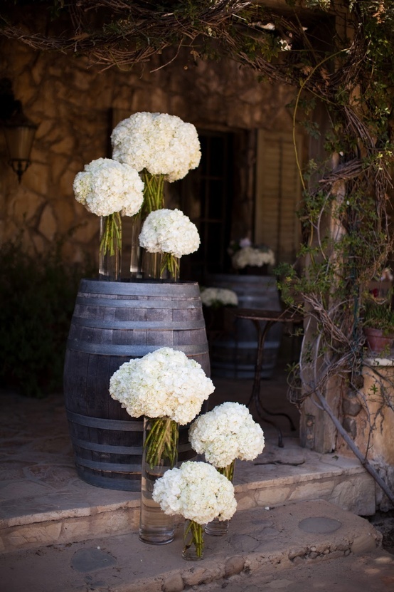 vineyard wedding ideas with wine barrels and hydrangeas