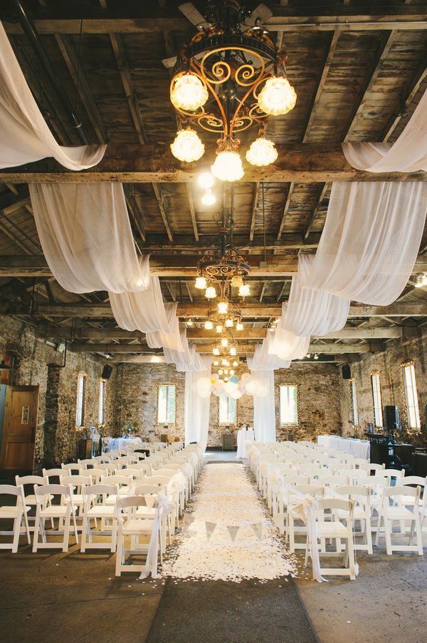 white confetti aisle drapery above ceremony