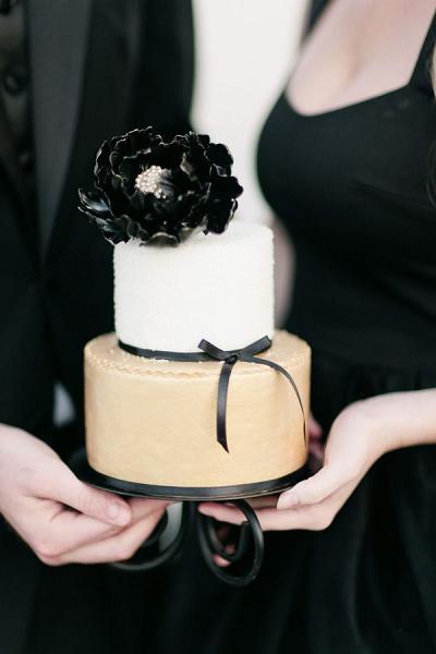 Bride and groom white and black wedding cake