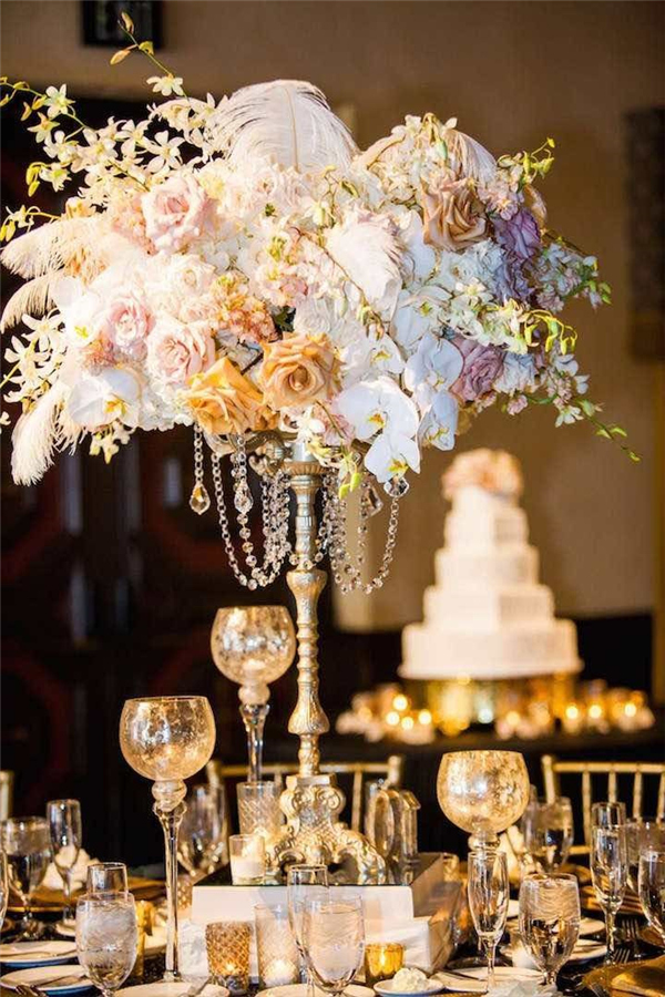 Gorgeous floral centerpiece ideas with pastel flowers, crystal beads and fluffy feathers