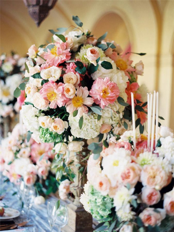 Overflowing blooms tall wedding centerpiece