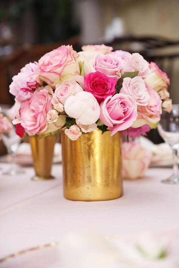 Pink roses and gold vessels wedding decor