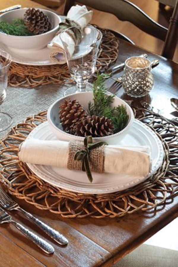 Rustic setting with twigs, fresh greens and pinecones