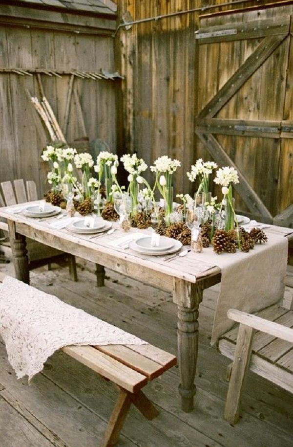 Rustic wedding table ideas with burlap, pinecones and simple glass vases with a few flowers