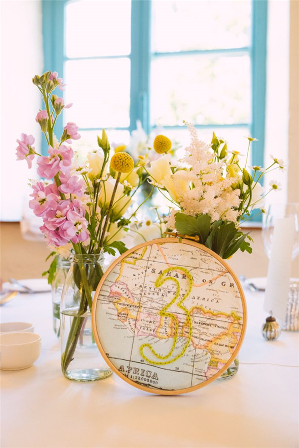 25 Unique Embroidery Hoops Boho Wedding Decor Ideas 22 Travel inspired hand embroidered DIY centre pieces