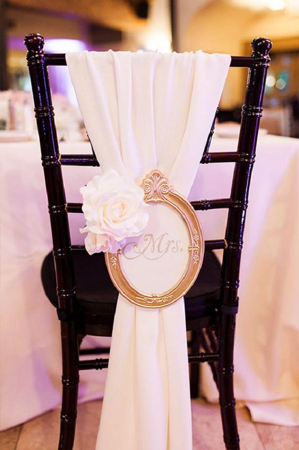 Vintage frame with Mrs. written in the center Wedding chair decor idea