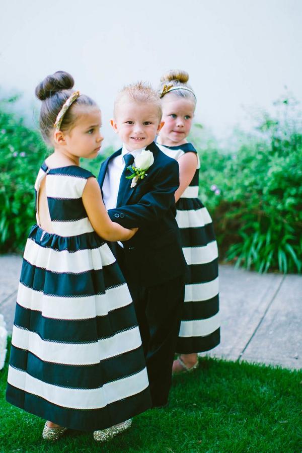 black and white stripes and a dapper suit flower girl and ring bearer