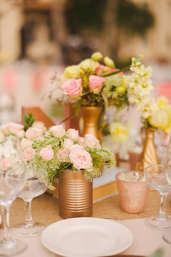 easy centerpiece idea- spray paint cans gold and fill with pretty flowers