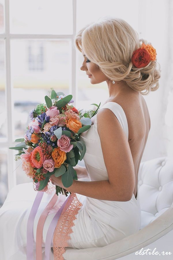 fall wedding hairstyle with orange flowers