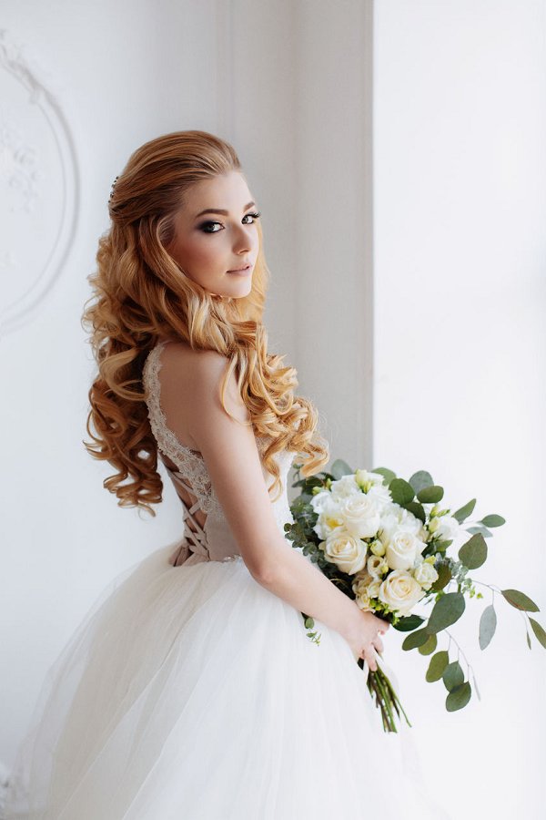 half down half up long curly wedding bridal hairstyle