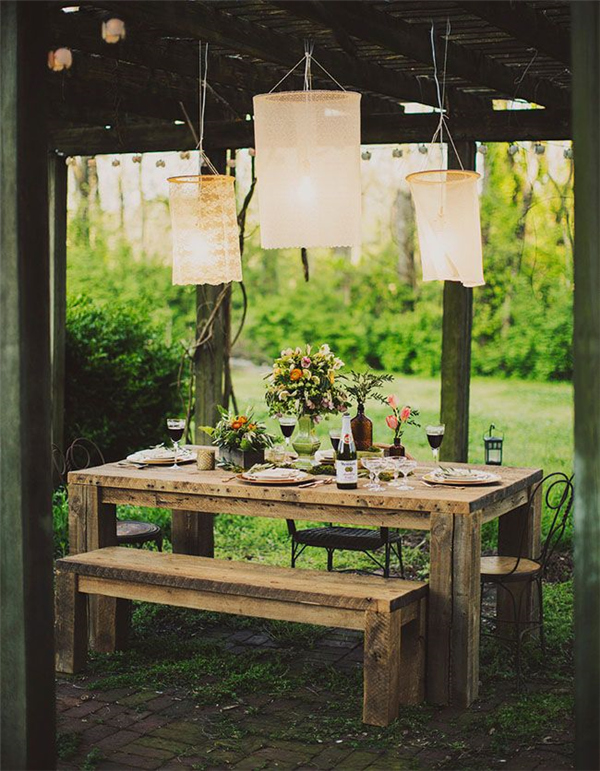 hanging lamps above a tablescape rustic wedding ideas