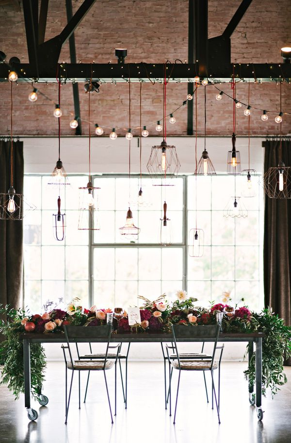 industrial wedding reception ideas with flowers and edison bulbs