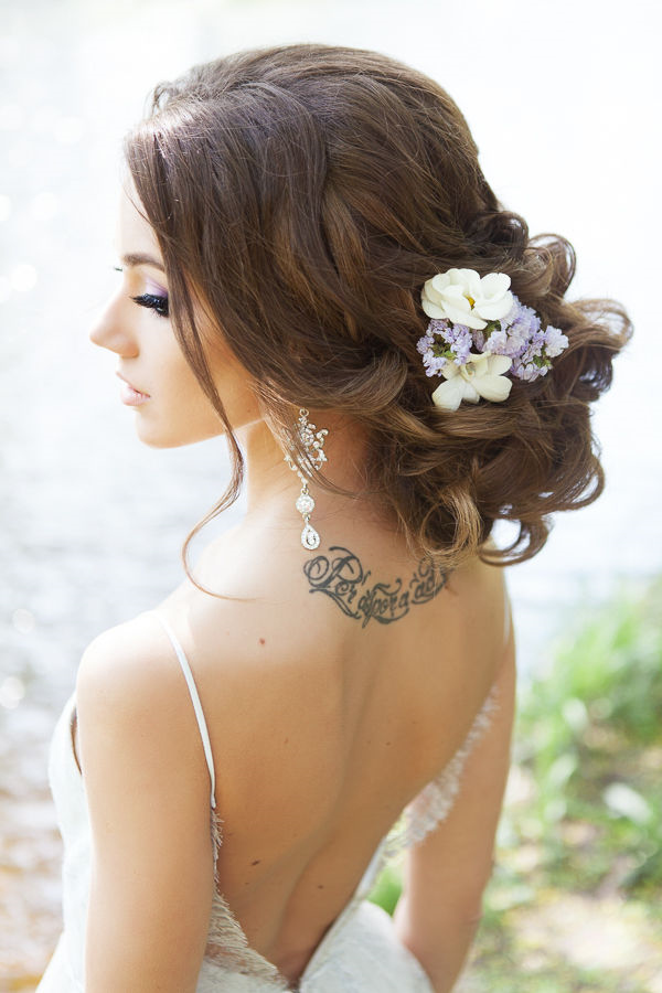 long bridal updo hairstyle with wildflower