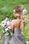 long curly hairstyle with lavender flower