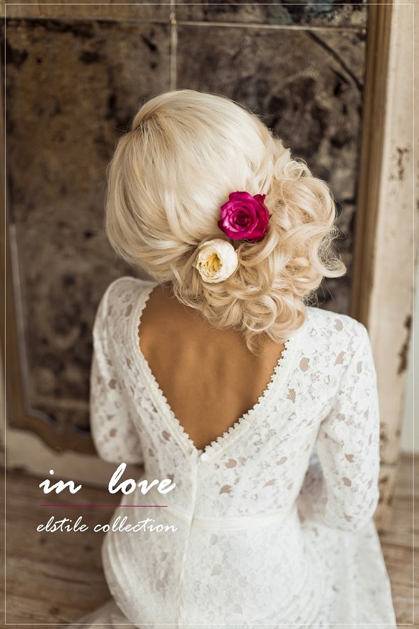 25 Romantic Long Wedding Hairstyles Using Flowers 24 low updo hairstyle for werdding with white and red flowers