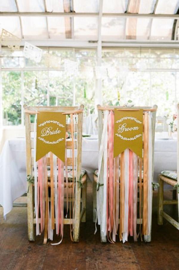 pink gold sash and bride and groom chairs