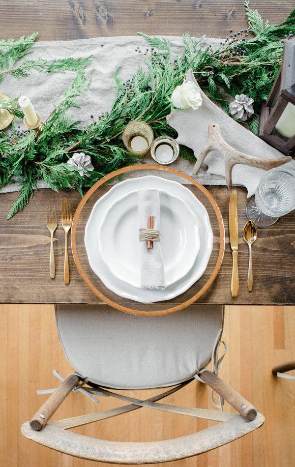 rustic fresh greens and antler woodland winter tablescape