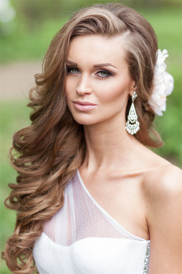 side-part long bridal hairstyle with flowers