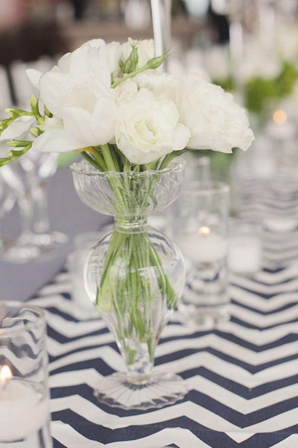 simple floral arrangement as table decor with chevron table runner