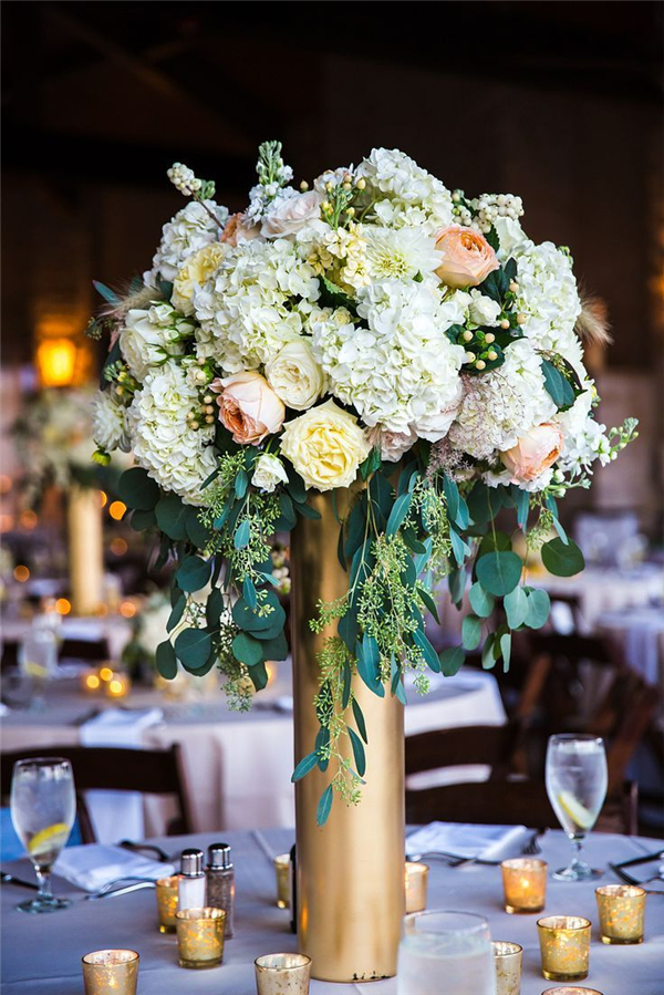white coral and yellow floral wedding centerpiece