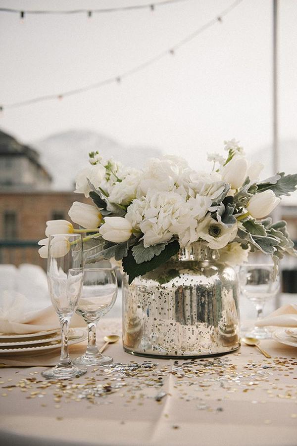 white flowers in silver vase wedding centerpiece