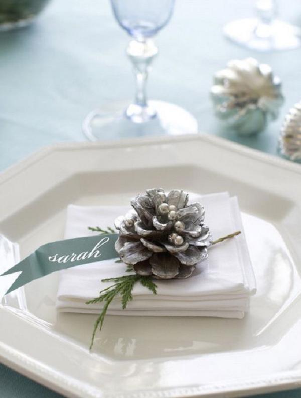 winter wedding table setting with pinecone
