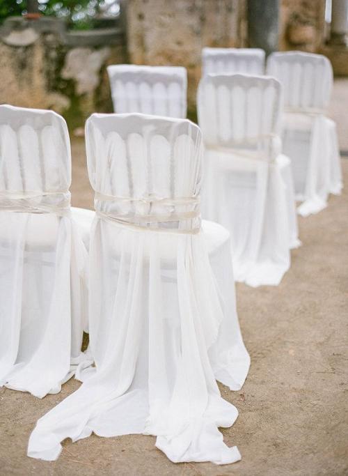 Dramatically draped white wedding chair cover decor