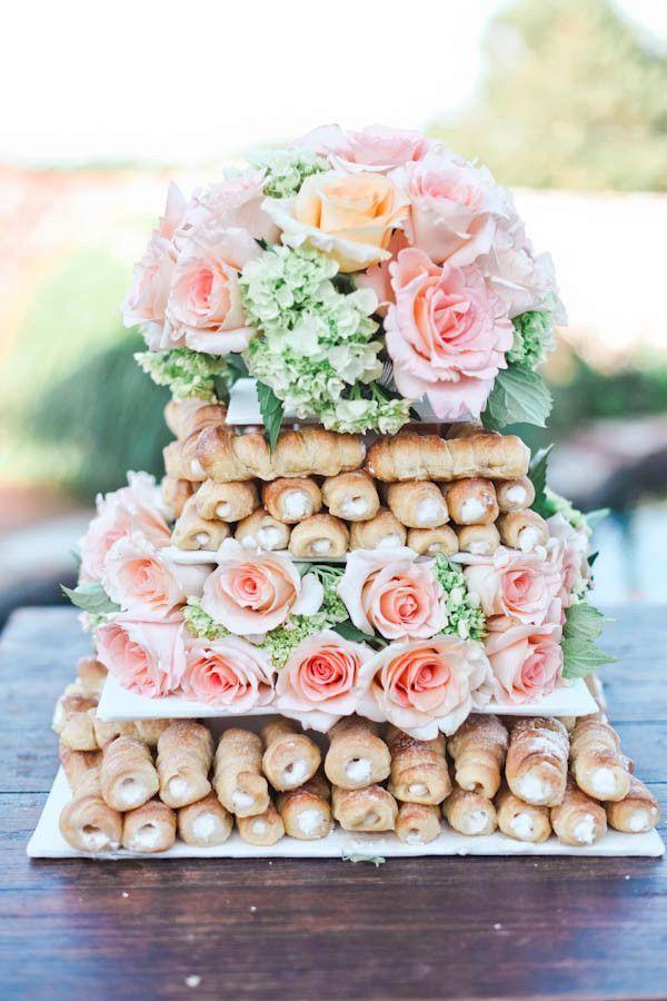 Fancy doughnut wedding cake with pink flowers