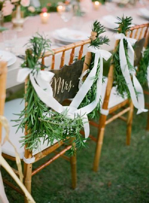30+ Signage Wedding Chair Decor Ideas We Love 19 Garland and ribbon bridal chairs