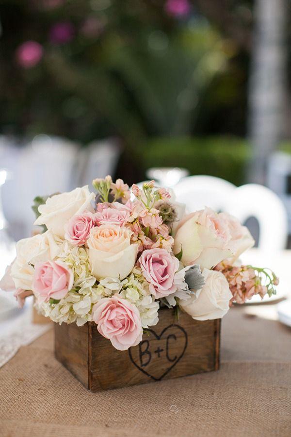 Monogram box with white snap dragons and blue hydrangas wedding centerpiece