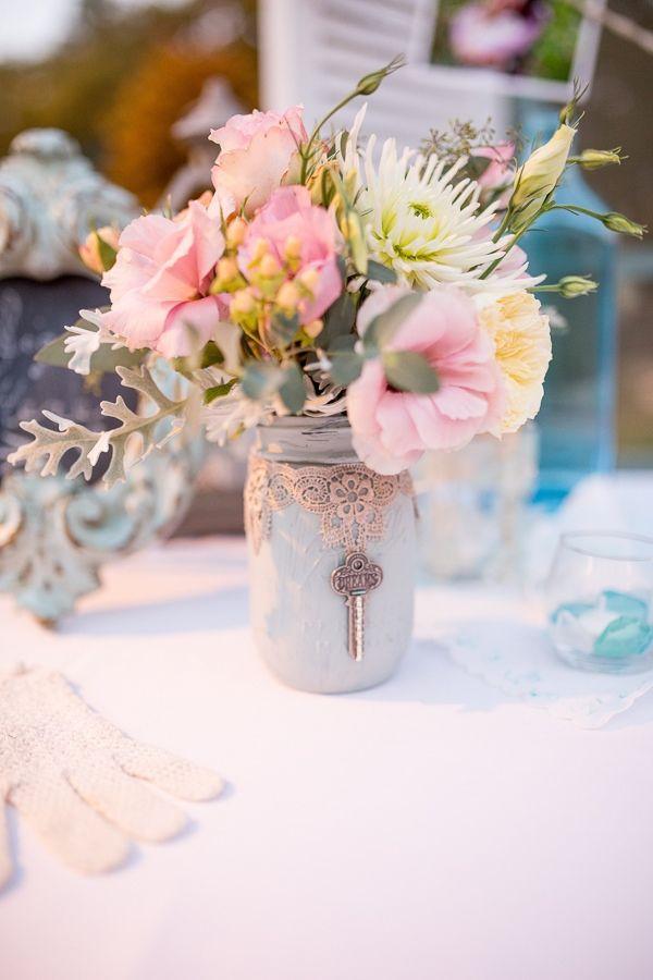 Painted mason jar with lace and a vintage key wedding centerpiece