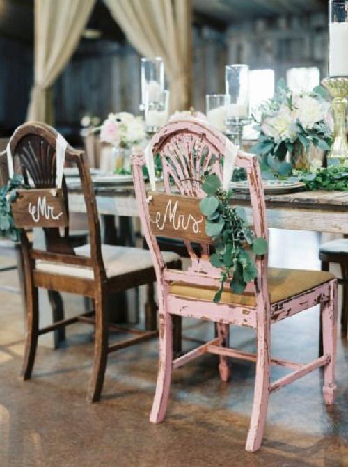 Rustic sweetheart chairs and sign wedding decor