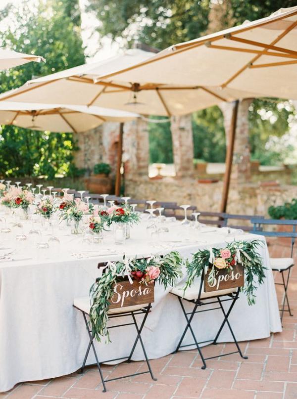 25 Wedding Reception Table Ideas That Will Wow Your Guests 18 Sposa and sposa sweetheart chairs wedding decor ideas