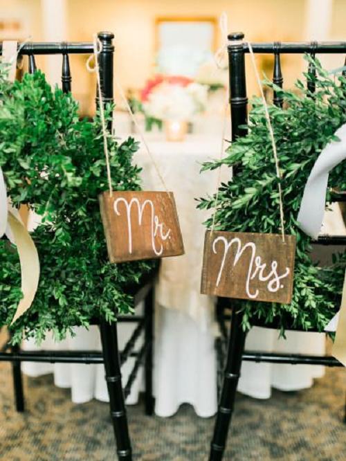 30+ Signage Wedding Chair Decor Ideas We Love 4 Wreath and wooden sign decorations