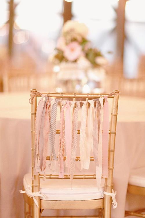 gold chairs with ribbons