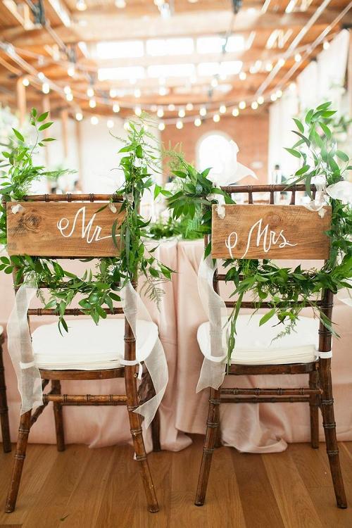 handpainted custom mr and mrs signs at industrial theme wedding reception