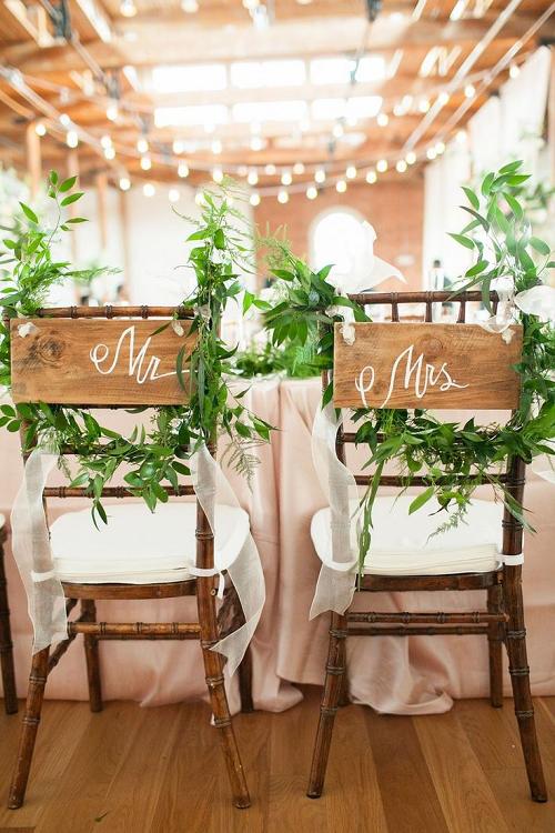 30+ Signage Wedding Chair Decor Ideas We Love 21 handpainted custom mr and mrs signs at industrial theme wedding reception