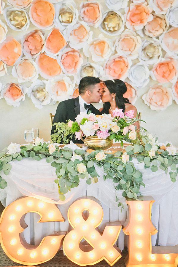 marquee lights and paper flower wedding backdrop
