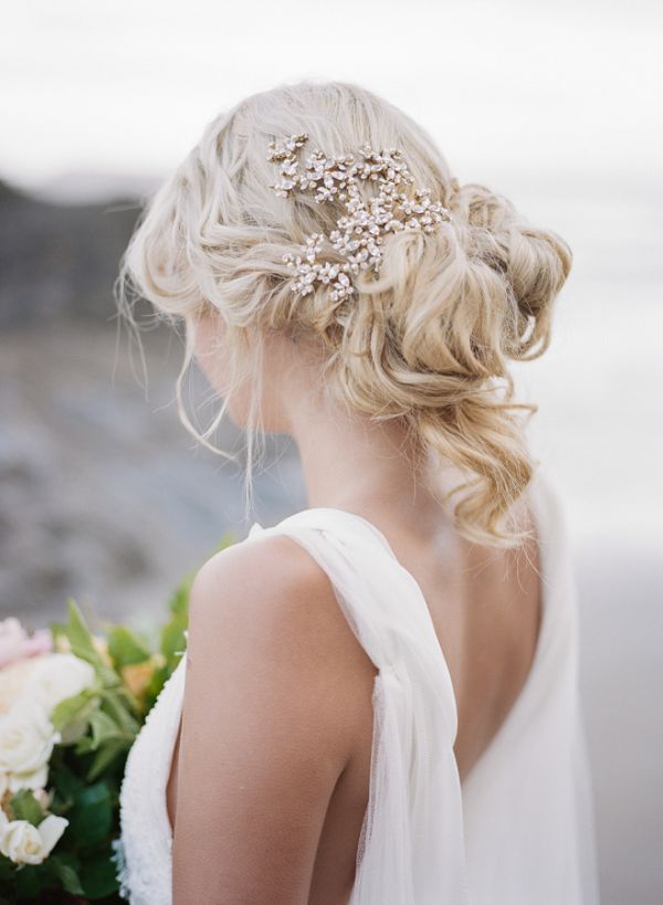messy wedding updo hairstyle with hair accessories