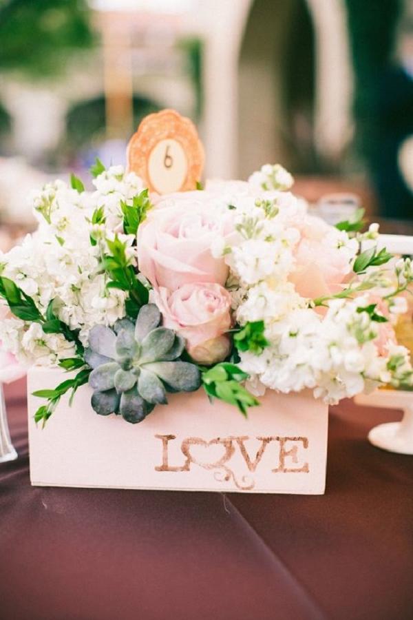 pink floral centerpiece with diy love sign