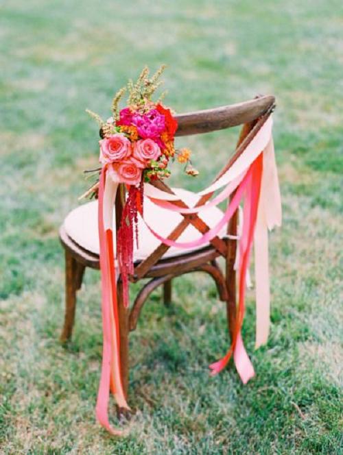 red ribbon decorated wedding chair