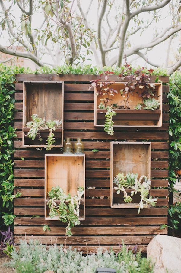 rustic wood pallets plants in boxes wedding backdrop