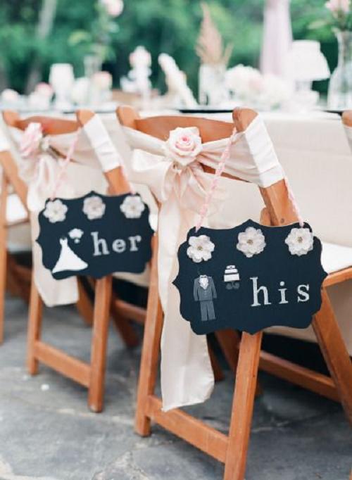 sweetheart chairs with cute wedding sign